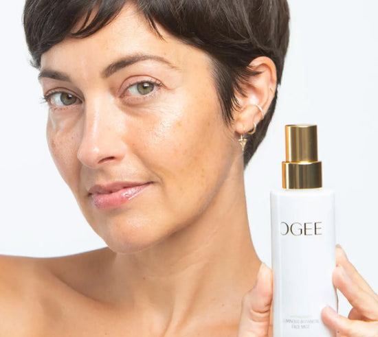 Woman holding Ogee skincare product