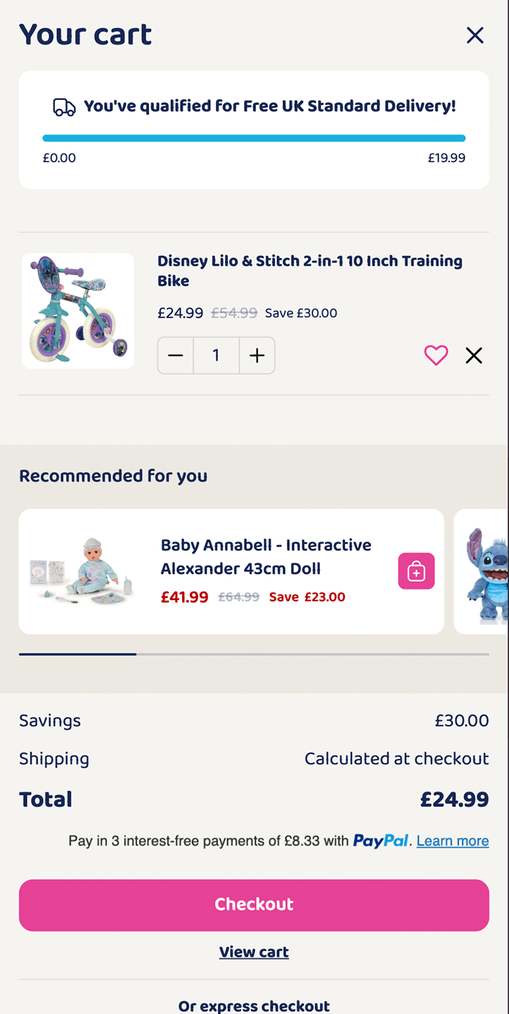 Cart page with Disney Lilo & Stitch bike and Baby Annabell doll, showing savings and checkout options.