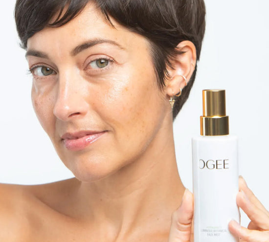 Woman holding Ogee skincare product 